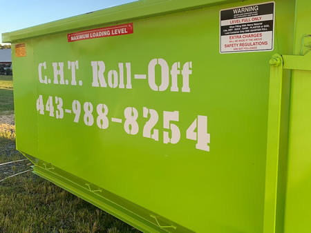 Roll off dumpster staged beside a home remodel in hillsboro md